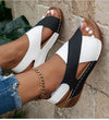 Medium height wedge sandals with open toe design and ankle strap
