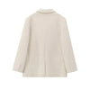 Detail of mohair blazer construction showing quality tailoring and creamy white finish