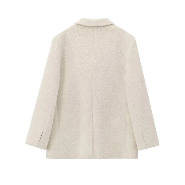 Detail of mohair blazer construction showing quality tailoring and creamy white finish