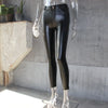 Back view of chic faux leather leggings, demonstrating the sculpting effect and smooth silhouette.