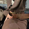 Vintage wide belt for women in black faux leather with metal buckle, perfect for casual or formal wear. Stylish accessory.