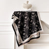 Elegant cashmere wrap with unique floral print, perfect for cold weather.