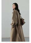 Elegant belted woolen trench with single-breasted closure and turtleneck