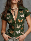 Short length butterfly print top with functional pockets and breathable polyester construction