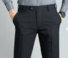Elegant slim fit men's suit trousers in black, crafted from cotton-polyester blend for comfort and style, perfect for formal