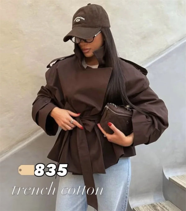 Women's short trench featuring tie belt and turn-down collar