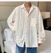 Men's Hollow Out Mesh Long-Sleeve Shirt in black and apricot, featuring breathable fabric and tailored fit for stylish comfor