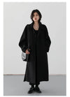 Classic belted trench coat offering warmth and refined elegance