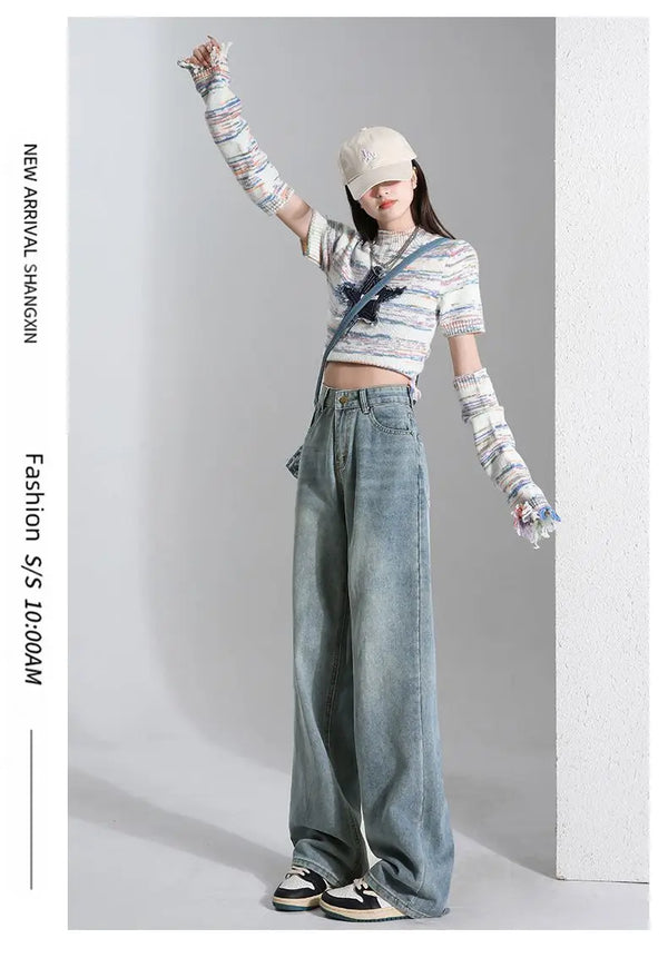 High-waist denim jeans styled with a trendy crop top for a retro vibe.