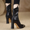 Women's black patent booties with square toe design and metal embellishments