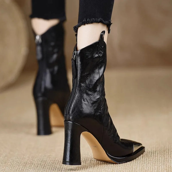 Women's black patent booties with square toe design and metal embellishments
