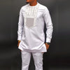 Colorful two-piece African set with coordinated patchwork prints on shirt and pants