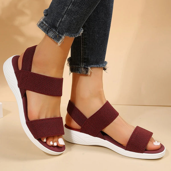Casual wedge sandals with adaptive stretch fabric and cushioned footbed for all-day comfort
