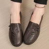 Close-up of buttery-soft leather loafer showing detailed floral embellishment