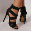 Elegant cream stiletto heels featuring a zip-up back and thin stilettos.