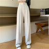 Full length view of high-waist trousers showing versatile styling with cropped top and modern wide leg shape