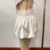 Two-piece lace ensemble styled for wedding guest attire