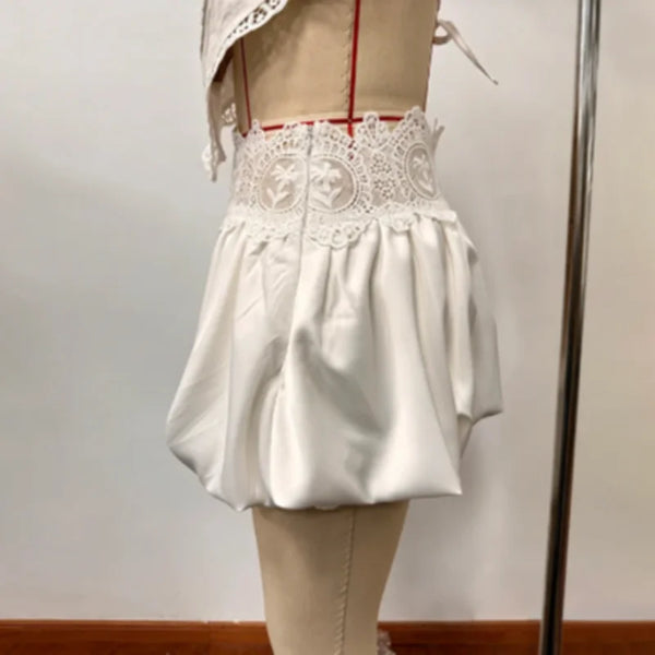 Two-piece lace ensemble styled for wedding guest attire