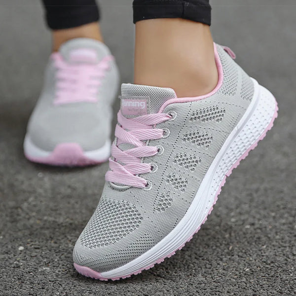 Lightweight white sports sneakers with multi-color accents for women