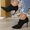 Elegant black stiletto heels with pointed toe for women, perfect for formal events.