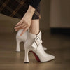 Pointed toe leather pumps with decorative buckle styled with tailored trousers
