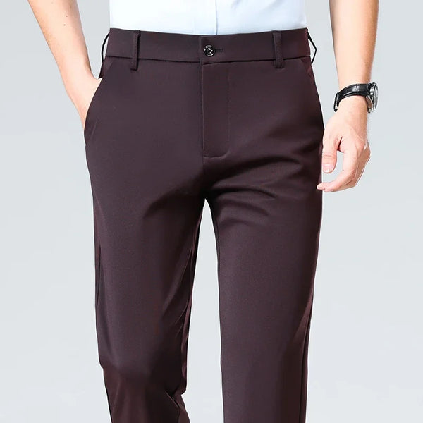 Stretch dress pants in navy blue with moisture-wicking polyester fabric for all-day comfort