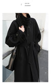 Elegant long trench in premium wool blend with contemporary styling