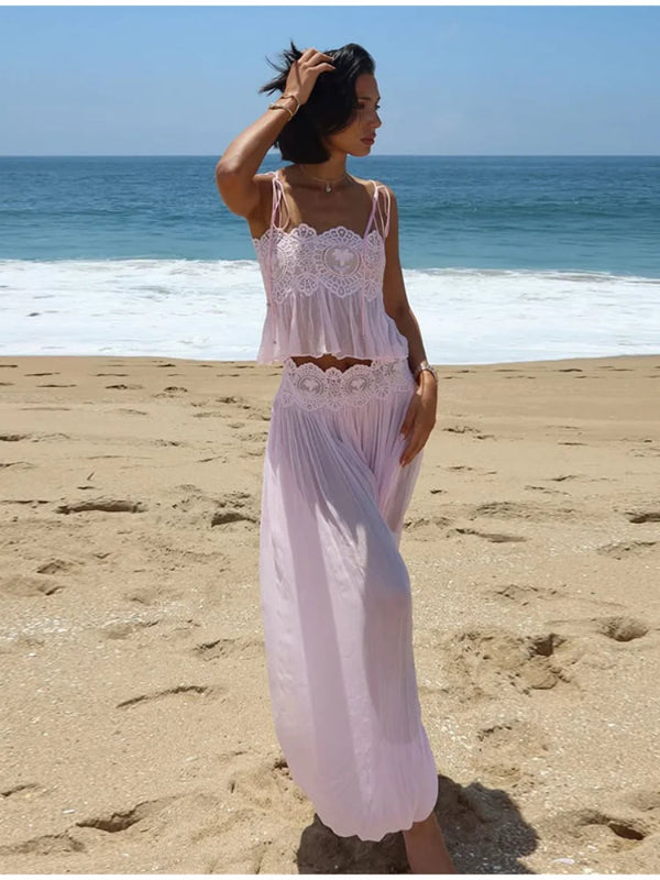 Woman wearing sophisticated sleeveless lace top with flowing palazzo pants