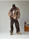 Woman wearing oversized plush hooded jacket with distressed detailing and relaxed fit