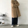 Chic Japanese vintage trench coat for men in black, featuring a single-breasted closure and stylish turn-down collar.