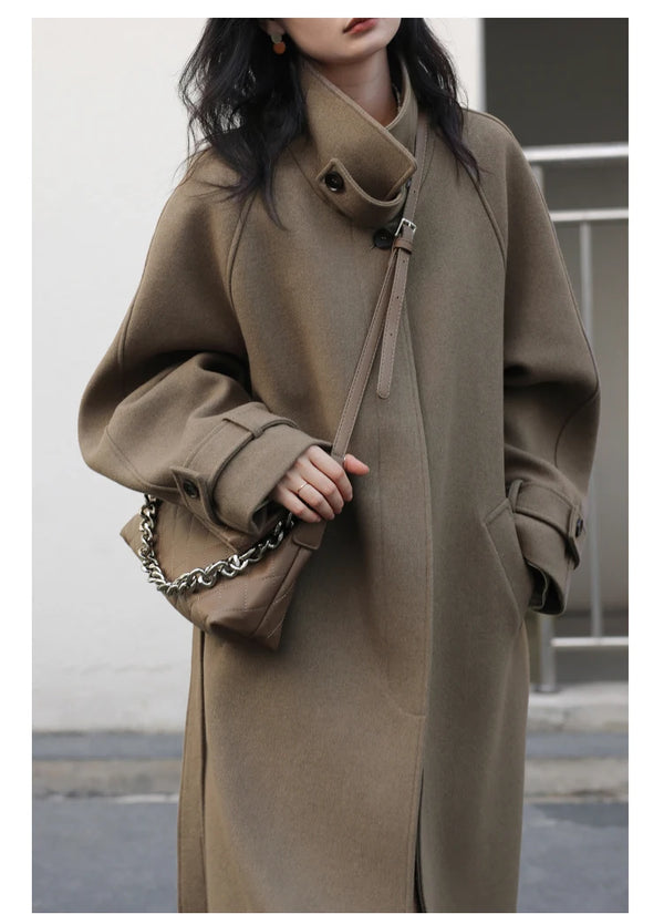Polished long coat with turtleneck collar and contemporary lace-up details