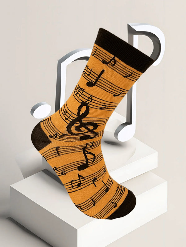 Close-up of stylish men's socks featuring musical notes, perfect for music lovers.