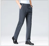 Professional in breathable polyester pants striding confidently through city business district