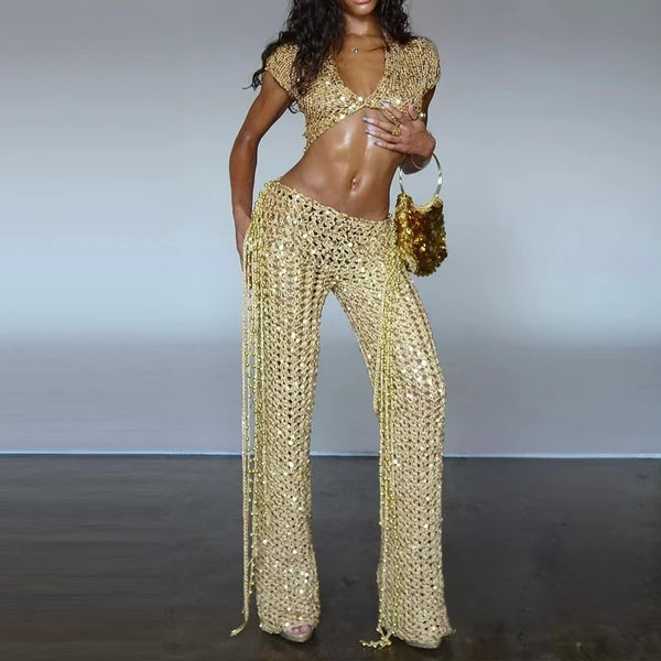 Silver sequined crop top and tassel skirt set on white background