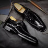 Polished black Oxford shoes with cushioned insoles for comfort.