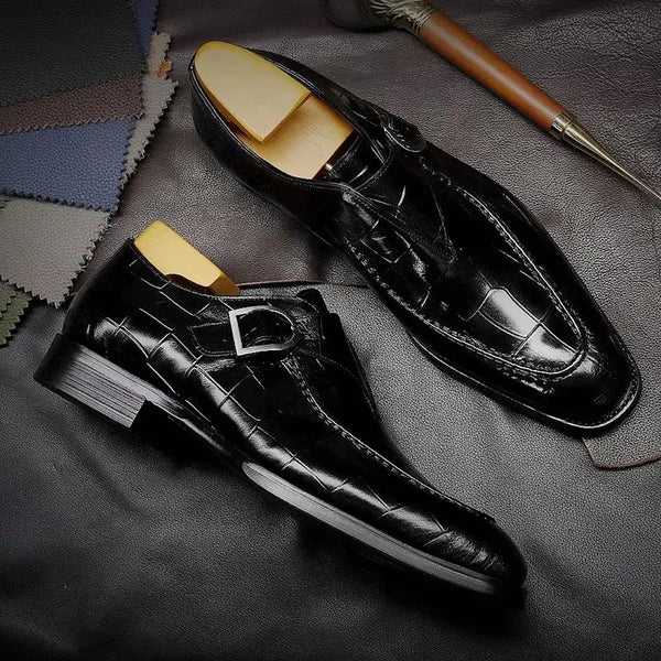 Polished black Oxford shoes with cushioned insoles for comfort.