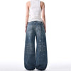 Trendy washed and ripped wide-leg women's jeans with distressed ink-splashed finish for a chic casual look.