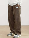 Textured corduroy drawstring pants showing soft fabric detail and comfortable relaxed cut
