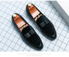 Men's leather loafers with tailored suit pants for business occasions