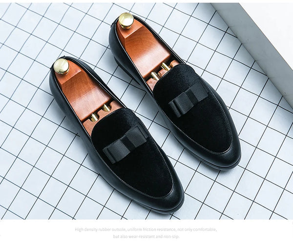 Men's leather loafers with tailored suit pants for business occasions