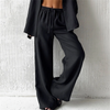 Flat lay of wide leg pants with pockets, showing full silhouette and design details
