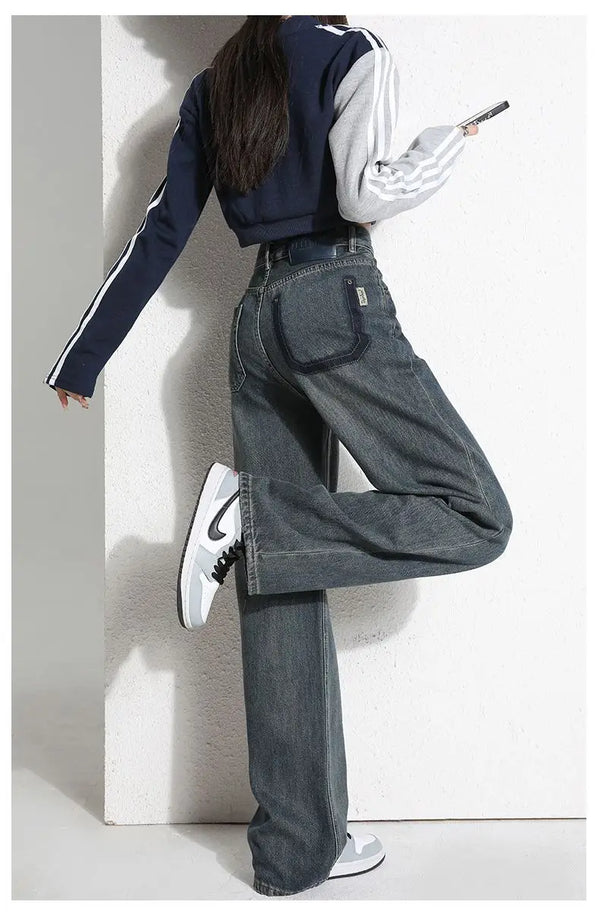 Model lounging in a café wearing Sunset Boulevard Denim, embodying West Coast lifestyle.