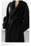 Refined long trench featuring sophisticated collar and flattering waist belt