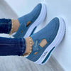 Side view of white mesh platform sneakers showing subtle heel lift and breathable design