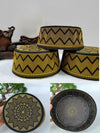 Embroidered gold flat-top Muslim cap for men with geometric patterns on premium fabric