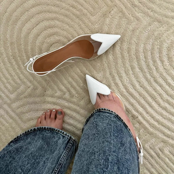 Crystal-clear PVC stiletto pumps with patent leather trim and ankle strap
