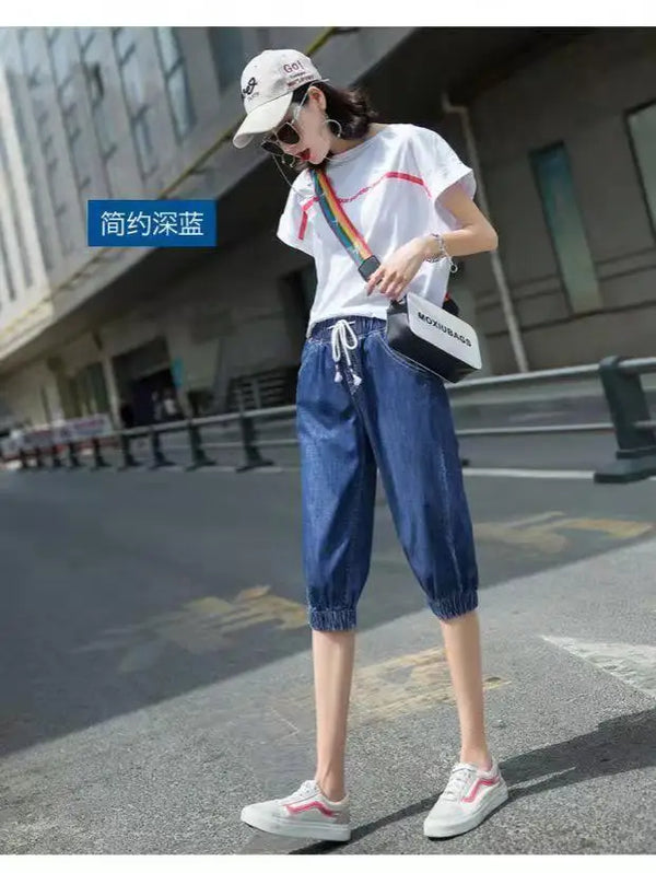 Breathable high-waist harem jeans in loose fit with functional pocket details