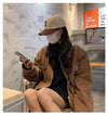 Model wearing Sunlit Days cap, enjoying a sunny day outdoors.