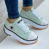 Stylish women's platform sneakers with mixed-color design and rubber outsole