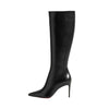 Brown designer boots with a pointed toe for a chic look.